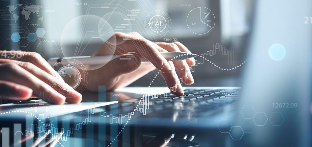 Data analyst using laptop analyzing financial data on futuristic virtual interface. 