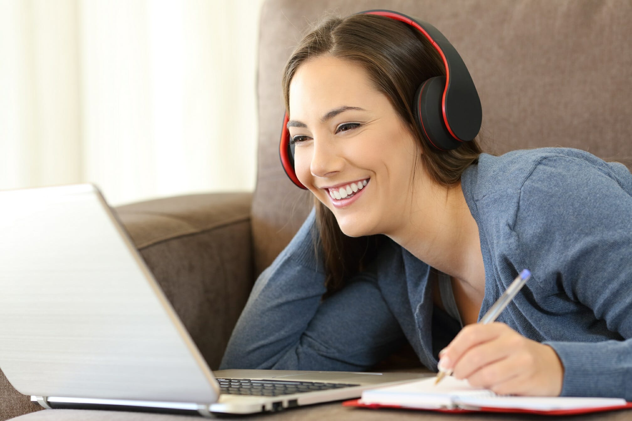 Female student working on online course remotely from home.