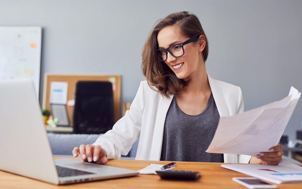 Gross Annual Income - Image of a woman working