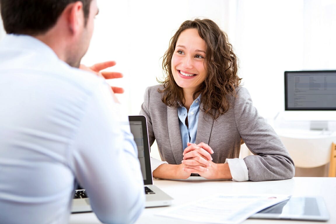 Mock Interview Guide - Image of a man interviewing a female applicant